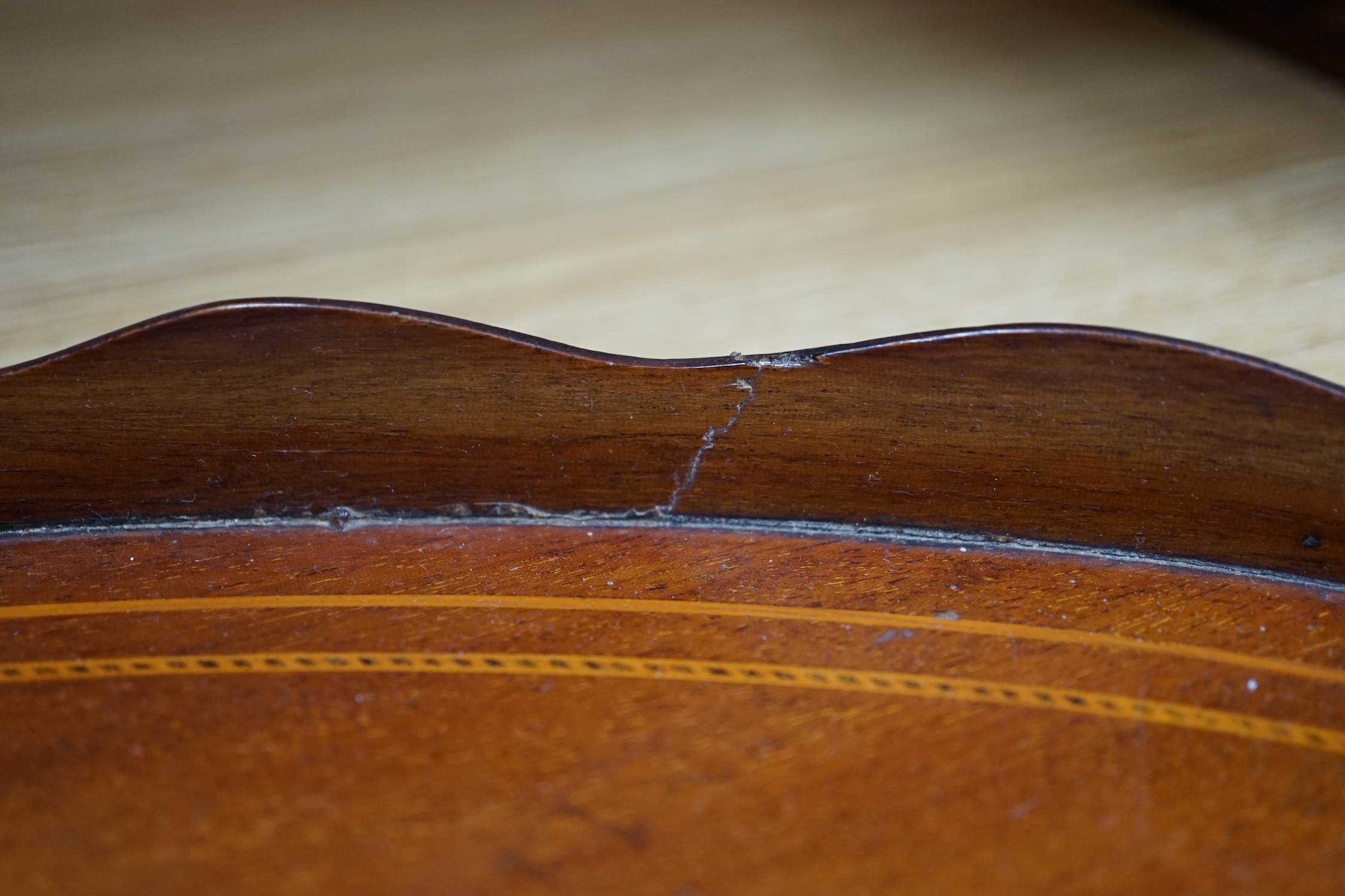 An Edwardian marquetry inlaid oval mahogany two handled tea tray, 63cm